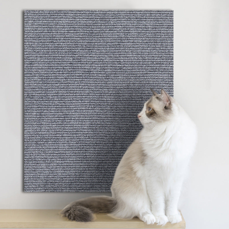 Cat scratching post protected by wall sticker | Pawnests